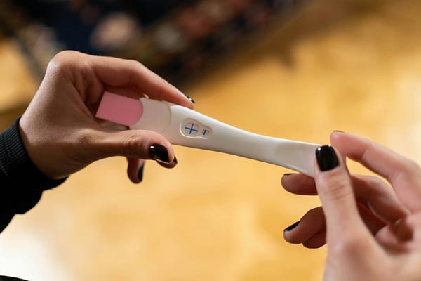Woman checking a pregnancy test.