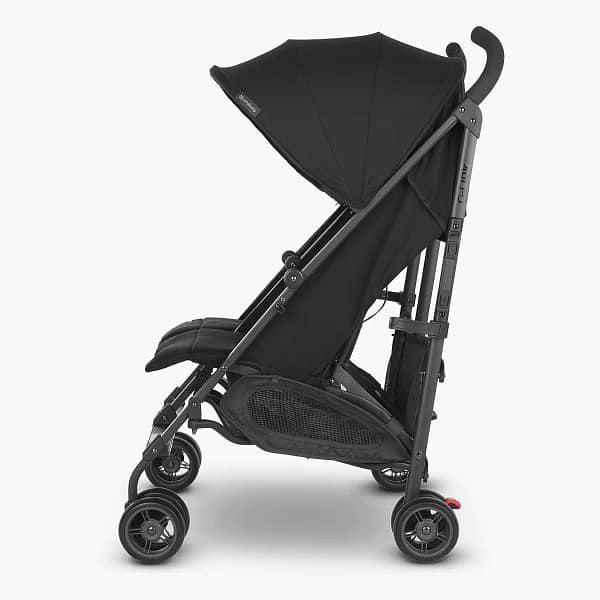 A sleek black double stroller from the side view.