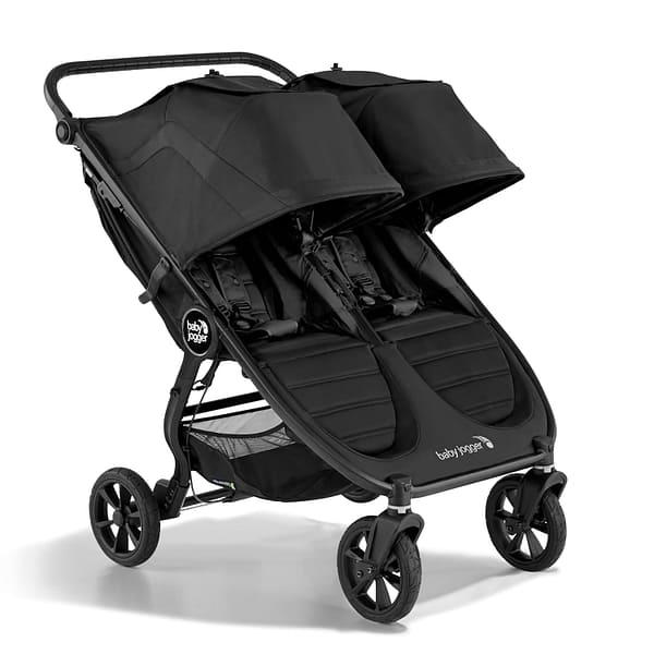 A lovely black travel stroller double, with large canopies for shade.